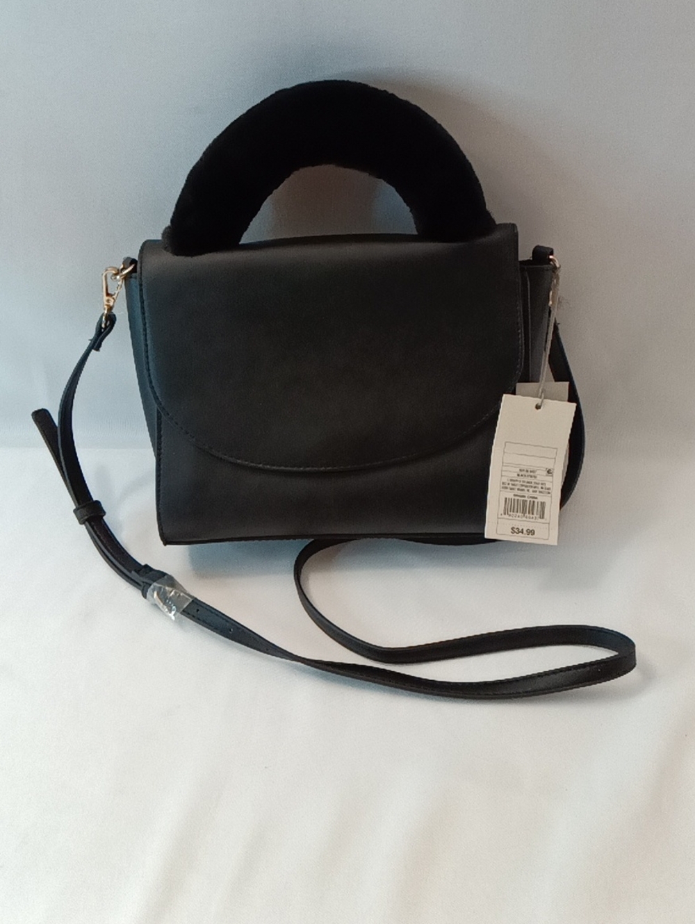 A new day Black Crossbody Bag. Soft Faux Fur Top Handle. Adjustable Strap.